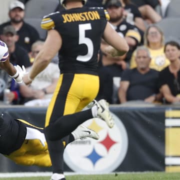 Aug 17, 2024; Pittsburgh, Pennsylvania, USA;  Buffalo Bills cornerback Daequan Hardy (25) returns a punt against  Pittsburgh Steelers linebacker Tyler Matakevich (44) and punter Cameron Johnston (5) during the first quarter at Acrisure Stadium. Mandatory Credit: Charles LeClaire-Imagn Images