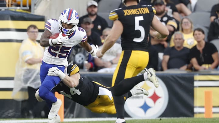 Aug 17, 2024; Pittsburgh, Pennsylvania, USA;  Buffalo Bills cornerback Daequan Hardy (25) returns a punt against  Pittsburgh Steelers linebacker Tyler Matakevich (44) and punter Cameron Johnston (5) during the first quarter at Acrisure Stadium. Mandatory Credit: Charles LeClaire-Imagn Images