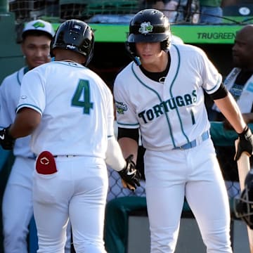 Daytona Tortugas Alfredo Alcantara gets congratulated from Tyson Lewis after scoring a solo home run during a game with the Palm Beach Cardinals at Jackie Robinson Ballpark in Daytona Beach, Saturday, July 26, 2025.