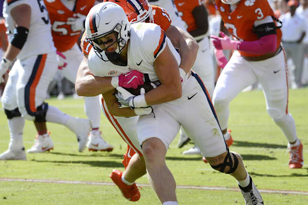 Virginia Cavaliers Tyler Neville moves the ball downfield against the Clemson Tigers at Memorial Stadium.