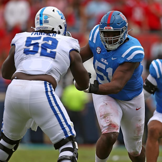Mississippi Rebels defensive linemen Zxavian Harris (51) rushes as Kentucky Wildcats offensive lineman Jalen Farmer (52).