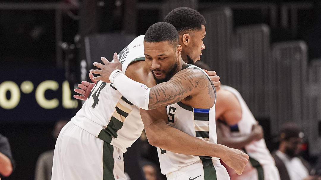 Mar 4, 2025; Atlanta, Georgia, USA; Milwaukee Bucks forward Giannis Antetokounmpo (34) and guard Damian Lillard (0) react after defeating the Atlanta Hawks at State Farm Arena. Mandatory Credit: Dale Zanine-Imagn Images
