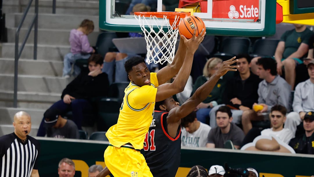 Mar 7, 2026; Waco, Texas, USA; Baylor Bears center James Nnaji grabs a rebound against Utah Utes forward Ibrahima Traore (31) during the second half at Paul and Alejandra Foster Pavilion. Mandatory Credit: Chris Jones-Imagn Images Mar 7, 2026; Waco, Texas, USA; Baylor Bears center James Nnaji grabs a rebound against Utah Utes forward Ibrahima Traore (31) during the second half at Paul and Alejandra Foster Pavilion. Mandatory Credit: Chris Jones-Imagn Images