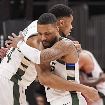 Mar 4, 2025; Atlanta, Georgia, USA; Milwaukee Bucks forward Giannis Antetokounmpo (34) and guard Damian Lillard (0) react after defeating the Atlanta Hawks at State Farm Arena. Mandatory Credit: Dale Zanine-Imagn Images