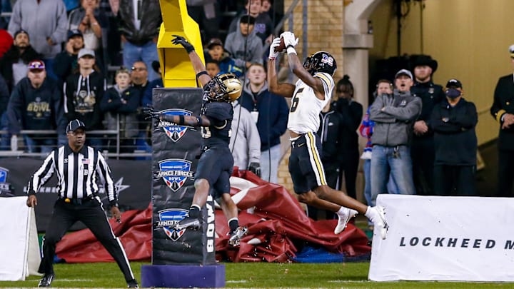 Dec 22, 2021; Fort Worth, Texas, USA; Missouri Tigers wide receiver Keke Chism (6) catches a touchdown pass with Army Black Knights defensive back Marquel Broughton (20) defending during the fourth quarter of the 2021 Armed Forces Bowl at Amon G. Carter Stadium. Mandatory Credit: Andrew Dieb-Imagn Images Dec 22, 2021; Fort Worth, Texas, USA; Missouri Tigers wide receiver Keke Chism (6) catches a touchdown pass with Army Black Knights defensive back Marquel Broughton (20) defending during the fourth quarter of the 2021 Armed Forces Bowl at Amon G. Carter Stadium. Mandatory Credit: Andrew Dieb-Imagn Images