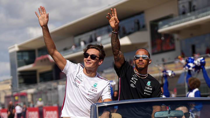 Mercedes-AMG Petronas drivers George Russell, left, and Lewis Hamiton, right, wave to the crowd during the drivers parade ahead of the Formula 1 Lenovo United States Grand Prix at Circuit of Americas on Sunday Oct. 22, 2023.