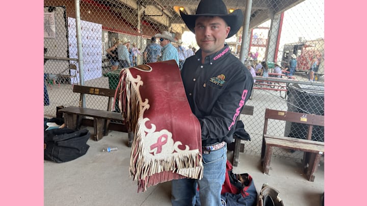 In honor of his mother's two bouts with breast cancer, Shane O'Connell  has a pink ribbon proudly displayed on his chaps. 