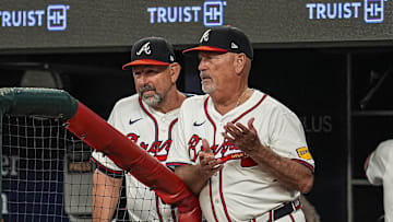 Jul 1, 2025; Cumberland, Georgia, USA; Atlanta Braves manager Brian Snitker (43) shown reacting in the dugout during the game against the Los Angeles Angels during the seventh inning at Truist Park. Mandatory Credit: Dale Zanine-Imagn Images
