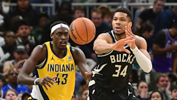 Apr 27, 2025; Milwaukee, Wisconsin, USA; Milwaukee Bucks forward Giannis Antetokounmpo (34) passes the ball away from Indiana Pacers forward Pascal Siakam (43) in the first quarter during game four of first round for the 2024 NBA Playoffs at Fiserv Forum. Mandatory Credit: Benny Sieu-Imagn Images