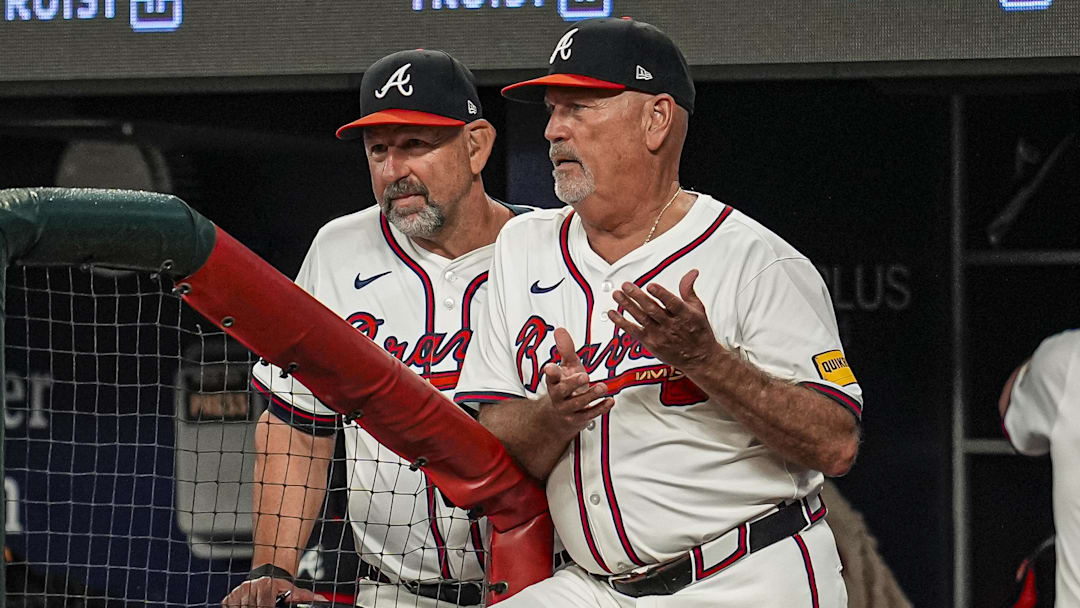 Jul 1, 2025; Cumberland, Georgia, USA; Atlanta Braves manager Brian Snitker (43) shown reacting in the dugout during the game against the Los Angeles Angels during the seventh inning at Truist Park. Mandatory Credit: Dale Zanine-Imagn Images