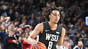 Jan 11, 2025; Spokane, Washington, USA; Washington State Cougars guard Nate Calmese (8) controls the ball against the Gonzaga Bulldogs in the second half at McCarthey Athletic Center. Mandatory Credit: James Snook-Imagn Images