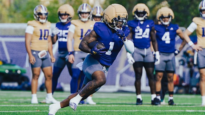 Jonah Coleman goes charging up the field during UW spring football. Jonah Coleman goes charging up the field during UW spring football.