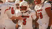 Louisville Caulin Lacy's (5) touchdown is celebrated during the 91st Tony the Tiger Sun Bowl game against Washington on Tuesday, Dec. 31, 2024 at the Sun Bowl Stadium in El Paso, Texas.