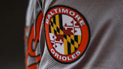 May 5, 2024; Cincinnati, Ohio, USA; The Baltimore Orioles logo on the sleeve of designated hitter Gunnar Henderson (2) as he prepares on deck during the seventh inning against the Cincinnati Reds at Great American Ball Park. Mandatory Credit: Katie Stratman-Imagn Images