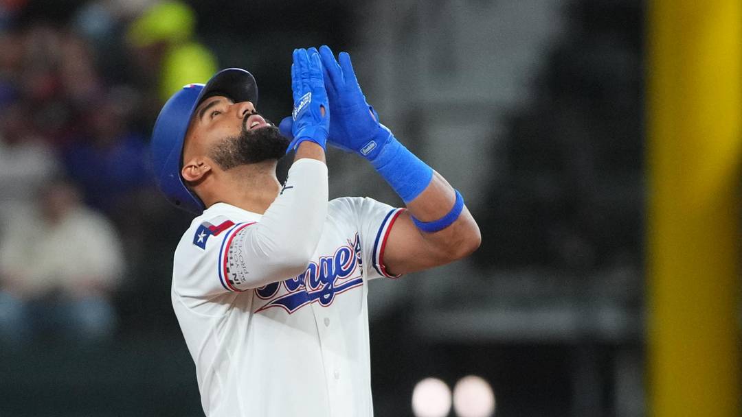 May 26, 2026; Arlington, Texas, USA; Texas Rangers second baseman Ezequiel Duran (20) reacts at second base after hitting an RBI double against the Houston Astros during the first inning at Globe Life Field. Mandatory Credit: Raymond Carlin III-Imagn Images