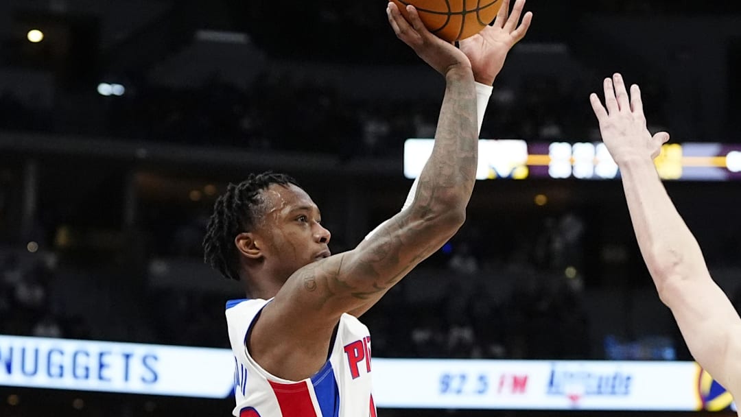 Dec 28, 2024; Denver, Colorado, USA; Detroit Pistons forward Ronald Holland II (00) shoots the ball over Denver Nuggets guard Christian Braun (0) in the second half at Ball Arena. Mandatory Credit: Ron Chenoy-Imagn Images