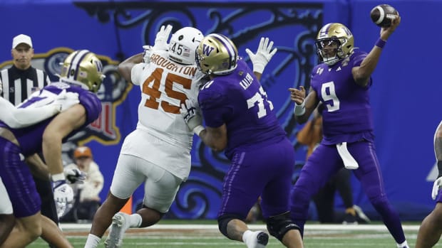 Jan 1, 2024; New Orleans, LA, USA; Washington Huskies quarterback Michael Penix Jr. (9) passes the ball as Texas Longhorns de