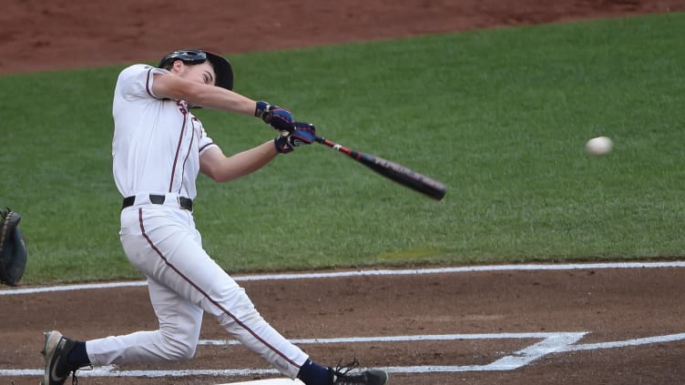 Virginia Cavaliers catcher Kyle Teel (3) singles in a run