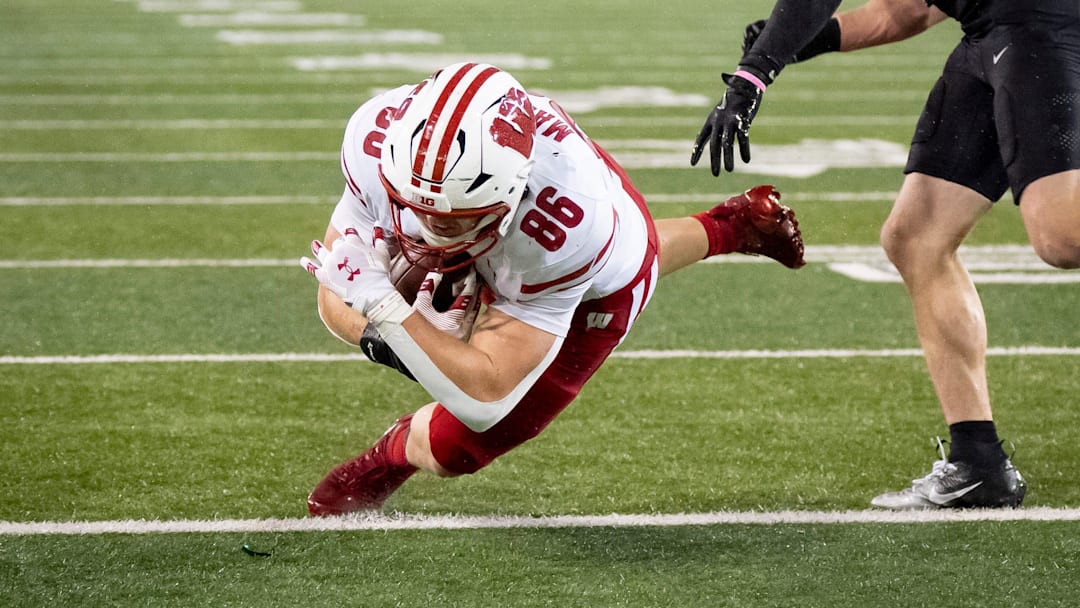 Wisconsin tight end Lance Mason scores for the Badgers. Wisconsin tight end Lance Mason scores for the Badgers.
