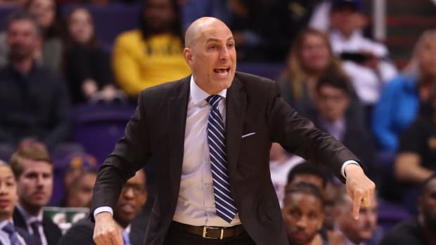 Los Angeles Clippers assistant coach Rex Kalamian reacts against the Phoenix Suns during a 2020 season game.