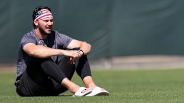 Feb 17, 2025; Bradenton, FL, USA;  Pittsburgh Pirates pitcher Paul Skenes (30) looks on from the outfield during spring training workouts at Pirate City. Mandatory Credit: Nathan Ray Seebeck-Imagn Images