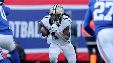 Dec 8, 2024; East Rutherford, New Jersey, USA; New Orleans Saints running back Alvin Kamara (41) runs with the ball against the New York Giants during the second quarter at MetLife Stadium. Mandatory Credit: Brad Penner-Imagn Images