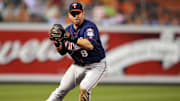 July 22, 2010; Baltimore, MD, USA; Minnesota Twins third baseman Nick Punto fields a ground ball against the Baltimore Orioles at Oriole Park at Camden Yards.