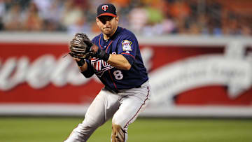 July 22, 2010; Baltimore, MD, USA; Minnesota Twins third baseman Nick Punto fields a ground ball against the Baltimore Orioles at Oriole Park at Camden Yards.