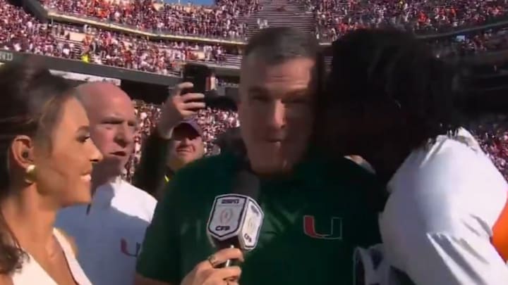 Miami football legend Michael Irvin couldn’t help but lay a smooch on coach Mario Cristobal after the Hurricanes won at Texas A&M to begin the College Football Playoff.