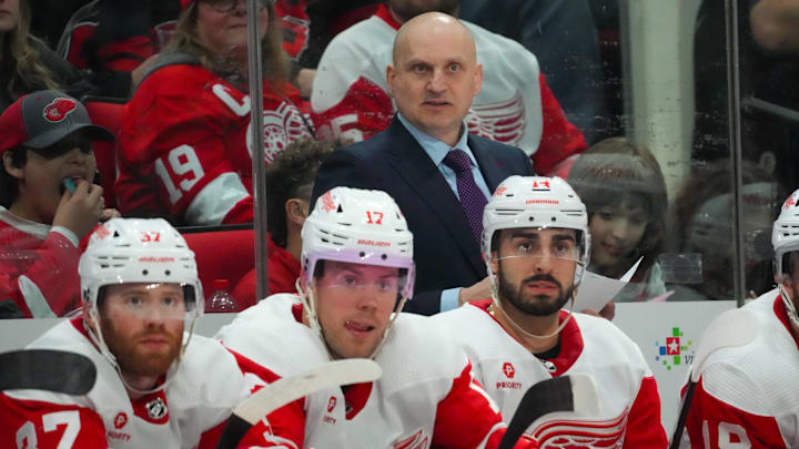 Detroit Red Wings head coach Derek Lalonde looks on from behind the bench against the Carolina Hurricanes. Detroit Red Wings head coach Derek Lalonde looks on from behind the bench against the Carolina Hurricanes.
