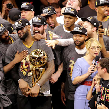Jun 19, 2016; Oakland, CA, USA; Cleveland Cavaliers forward LeBron James (23) celebrates with the Larry O'Brien Championship Trophy after beating the Golden State Warriors in game seven of the NBA Finals at Oracle Arena. Mandatory Credit: Kelley L Cox-Imagn Images