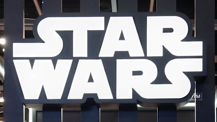 Visitors are seen at Disney's Star Wars booth during the Ani...