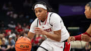 Nov 9, 2025; Charlotte, North Carolina, USA;  NC State Wolfpack guard Zoe Brooks (35) drives the ball against the Southern California Trojans during the second quarter of the Ally Tipoff game at Spectrum Center. Mandatory Credit: Cory Knowlton-Imagn Images