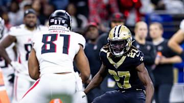 Jan 7, 2024; New Orleans, Louisiana, USA;  Atlanta Falcons tight end Jonnu Smith (81) rushes against New Orleans Saints cornerback Isaac Yiadom (27) during the first half at Caesars Superdome. Mandatory Credit: Stephen Lew-Imagn Images