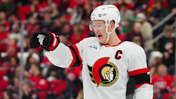 Nov 16, 2024; Raleigh, North Carolina, USA;  Ottawa Senators left wing Brady Tkachuk (7) reacts during the first period against the Carolina Hurricanes at Lenovo Center. Mandatory Credit: James Guillory-Imagn Images