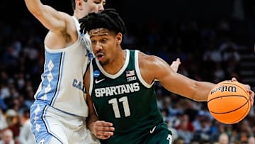 Michigan State guard A.J. Hoggard (11) dribbles against North Carolina guard Cormac Ryan (3) during