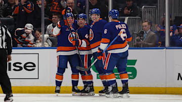 Mar 1, 2025; Elmont, New York, USA; New York Islanders center Jean-Gabriel Pageau (44) celebrates a goal with teammates against the Nashville Predators during the first period at UBS Arena. Mandatory Credit: Thomas Salus-Imagn Images