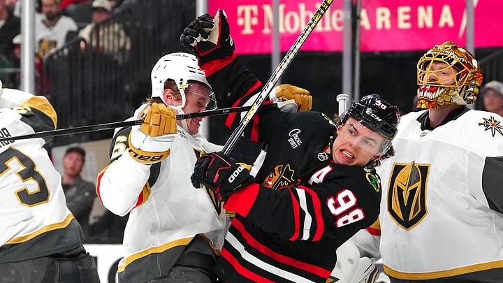 Mar 14, 2026; Las Vegas, Nevada, USA; Vegas Golden Knights defenseman Kaedan Korczak (6) checks Chicago Blackhawks center Connor Bedard (98) during the first period at T-Mobile Arena. Mandatory Credit: Stephen R. Sylvanie-Imagn Images