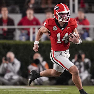 Nov 15, 2025; Athens, Georgia, USA; Georgia Bulldogs quarterback Gunner Stockton (14) runs the ball in the first half against the Texas Longhorns at Sanford Stadium. Mandatory Credit: Dale Zanine-Imagn Images
