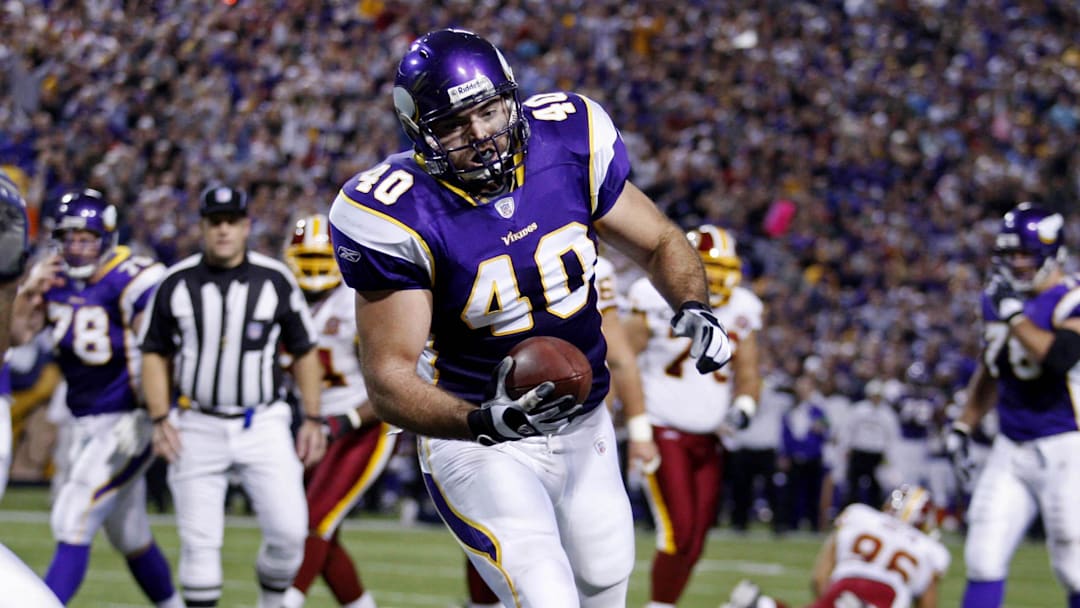 Dec 23, 2007; Minneapolis, Minnesota, USA: Minnesota Vikings tight end (40) Jim Kleinsasser scores a touchdown against the Washington Redskins at the Metrodome. Redskins win 32-21. Mandatory credit: Photo by Bruce Kluckhohn-Imagn Images