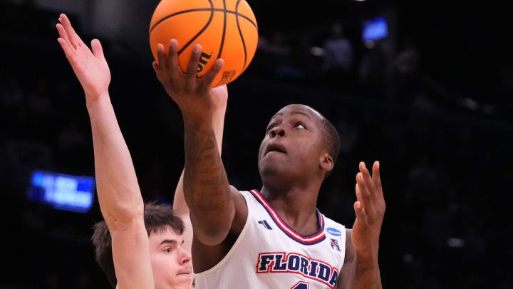 Florida Atlantic Owls guard Johnell Davis (1) shoots against Northwestern Wildcats guard Brooks Barnhizer (13) in the first round of the 2024 NCAA Tournament at the Barclays Center.