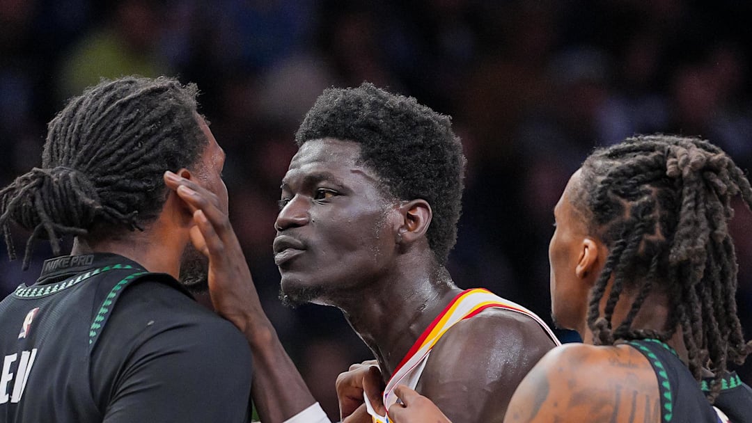 Mouhamed Gueye (18) and Minnesota Timberwolves center Naz Reid (11) push each other in the fourth quarter at Target Center.