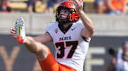 Oregon State Beavers punter Josh Green (2024) punts against the California Golden Bears
