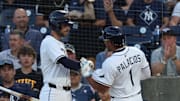 Tampa Bay's Richie Palacios (right) is congratulated by  Brandon Lowe after he scored a run against the New York Yankees. 