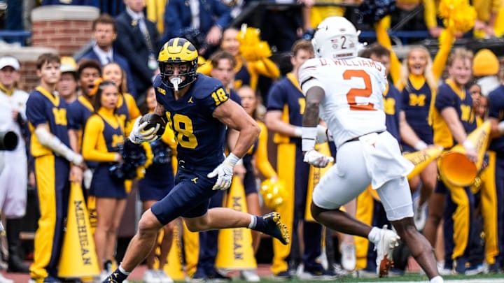 Michigan tight end Colston Loveland (18) makes a catch against Texas defensive back Derek Williams Jr. (2) during the first half at Michigan Stadium in Ann Arbor on Saturday, September 7, 2024.