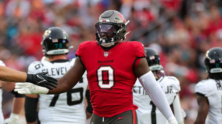 Dec 24, 2023; Tampa, Florida, USA;  Tampa Bay Buccaneers linebacker Yaya Diaby (0) and linebacker Anthony Nelson (98) react after a play against the Jacksonville Jaguars in the second quarter at Raymond James Stadium. Mandatory Credit: Nathan Ray Seebeck-USA TODAY Sports