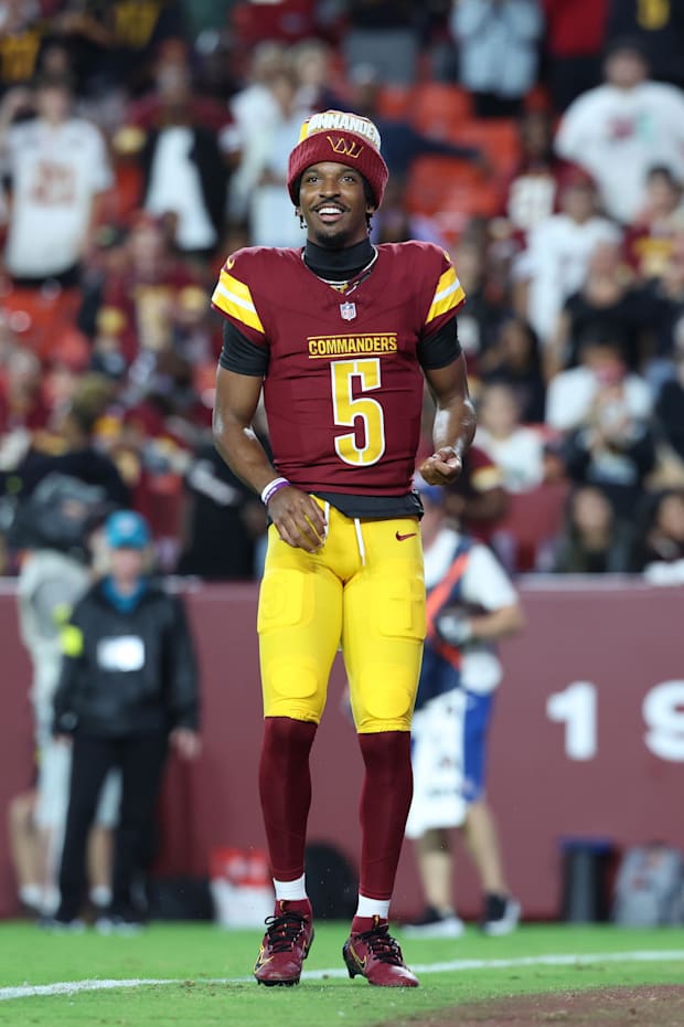 Washington Commanders quarterback Jayden Daniels requests the ball after running back Jacory Croskey-Merritt scores
