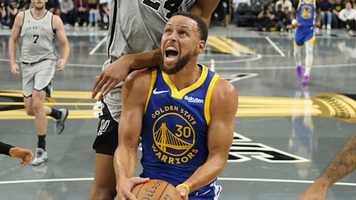 Golden State Warriors guard Stephen Curry drives to the basket against the San Antonio Spurs.