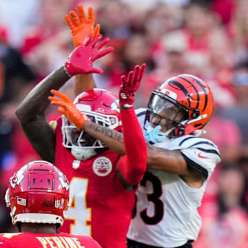 Kansas City Chiefs wide receiver Rashee Rice (4) and Cincinnati Bengals tight end Erick All Jr. (83) go up for a ball before the Bengals are penalized for pass interference in the fourth quarter of the NFL Week 2 game between the Kansas City Chiefs and the Cincinnati Bengals at Arrowhead Stadium in Kansas City on Sunday, Sept. 15, 2024. The Chiefs took a 26-25 win with a go-ahead field goal as time expired.