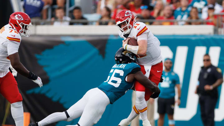 Aug 10, 2024; Jacksonville, Florida, USA; Jacksonville Jaguars linebacker Yasir Abdullah (56) sacks Kansas City Chiefs quarterback Carson Wentz (11) during the first quarter at EverBank Stadium. Mandatory Credit: Douglas DeFelice-USA TODAY Sports